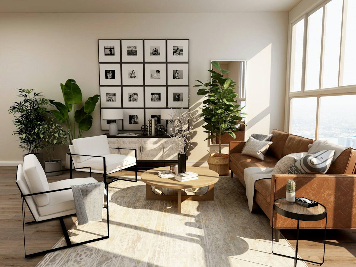 Bright living room with a sofa, large windows and open floor space
